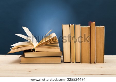 A pile of books on blue background