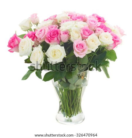 bouquet of fresh pink and white fresh roses in glass vase isolated on white background