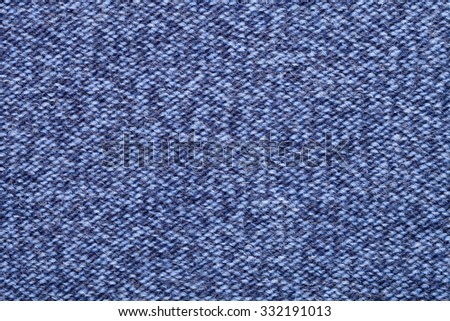 Blue knitted fabric made of heathered yarn textured background