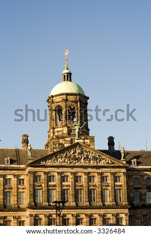 these buildings and architecture are around the monument in Dam Square in Amsterdam.