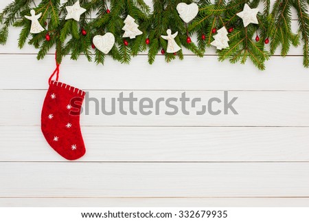 Christmas background. Christmas fir tree with decoration on white wooden board background with copy space