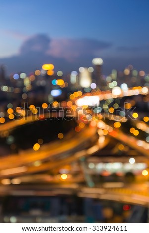 Aerial view city downtown road intersection during twilight, blurred bokeh light background