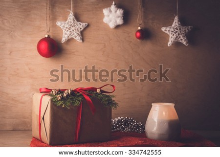 Christmas background with wooden toys, gifts and red ribbons