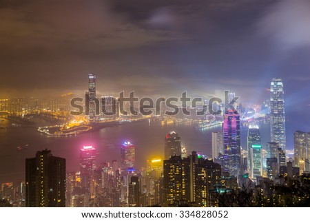Misty city and Skyscraper in fog at night - Hong Kong