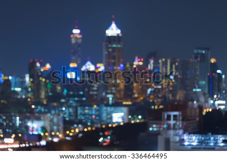 Night blurred bokeh city office building lights, abstract background