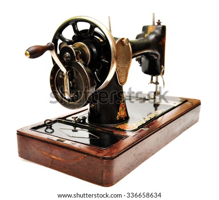 Old sewing machine isolated on white background