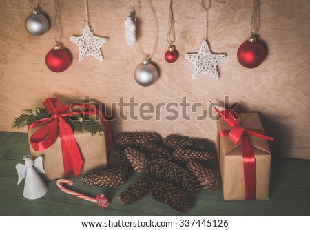 Christmas background with wooden toys, gifts and red ribbons