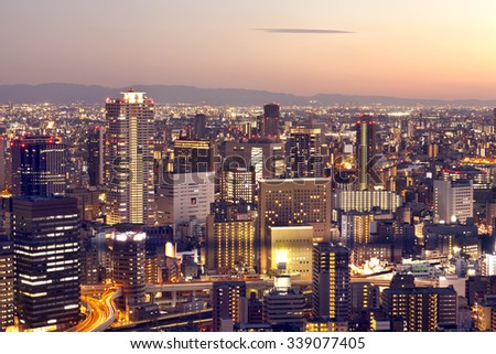 Aerial view of city skyline at colorful sunset, Osaka in Japan