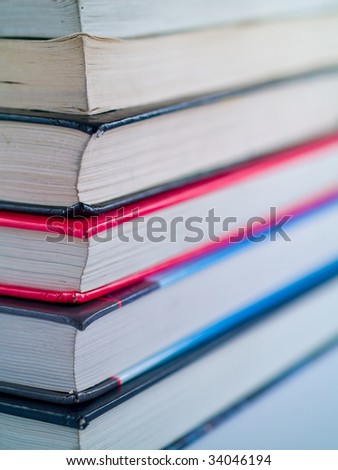 Stack of old textbooks viewed from the corner