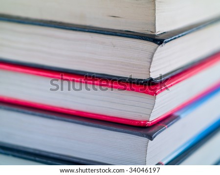 Stack of old textbooks viewed from the corner