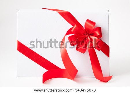 Isolated white box, bow and ribbon on white background