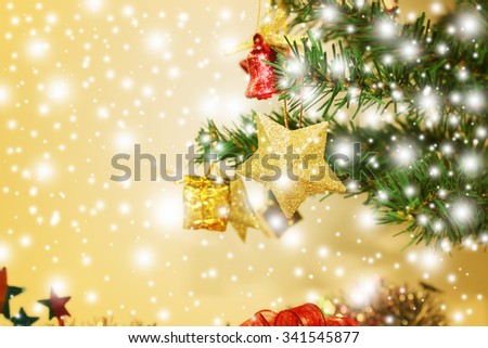 Christmas star on Christmas tree with golden Christmas backgroun