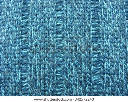 macro of beautiful blue winter sweater texture, background