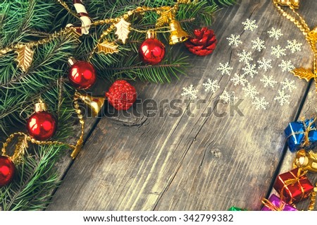 Branches of a Christmas tree on old boards. Christmas background. New Year background. Xmax background. Natural color. Do not toned.
