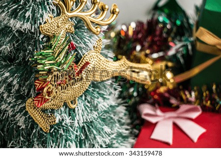 Reindeer and ornament, Merry Christmas night light. Christmas tree and other decoration with Lovely bear, a gift,  and ribbon .