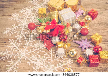 Chrismas baubles and vary of decoration on wood background,vintage color