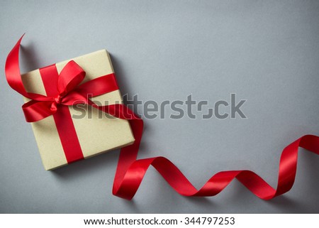 Rustic gift box with red ribbon, with copy space