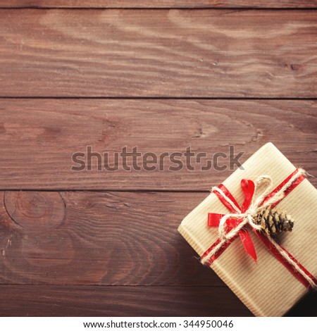 Handmade christmas gift box on wooden table with copy space
