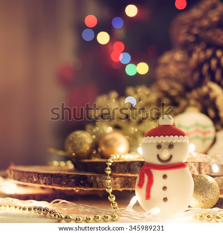 Christmas decoration. Cookie in the shape of a snowman. Shallow depth of field. 