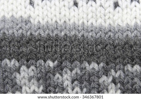 Texture. Knitted fabric. Melange. Grey and white