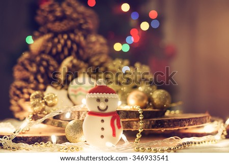Christmas decoration. Cookie in the shape of a snowman. Shallow depth of field.