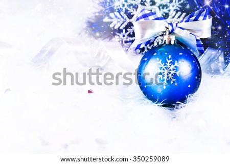Christmas card with blue decoration on silver background