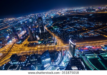 United Arab Emirates Dubai 07/14/2014 downtown dubai futuristic city neon lights and sheik zayed road shot from the worlds tallest tower building in Dubai