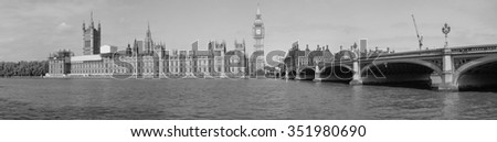 High resolution panoramic view of the Houses of Parliament Big Ben and Westminster Bridge seen from river Thames in London, UK in black and white