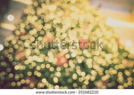 Gold Christmas background of de-focused lights with decorated tree, Christmas background 