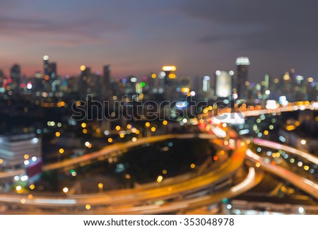Abstract blurred bokeh light city downtown background and highway intersection night view