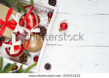 Beautiful christmas red and golden balls with tapes and decorations.