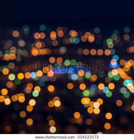 beautiful city lights background with blurring bokeh in twilight, closeup 