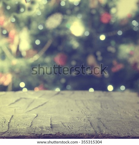 Christmas tree and old table background.Vintage photo.