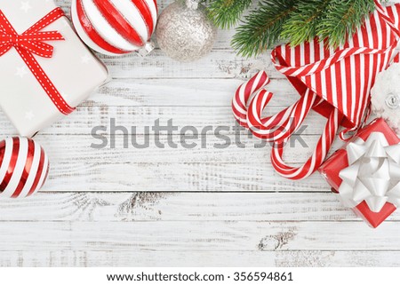 Christmas decoration with fir tree and gift boxes on wooden background

