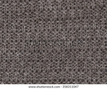Brown texture wool fabric with fibers and hair. Closeup