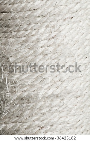 Texture of the braided white rough cord closeup