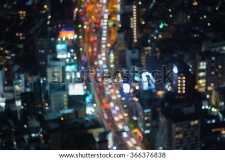 Blurred bokeh aerial view Tokyo city downtown with busy road night view