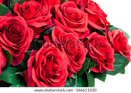 bouquet of blossoming artificial dark red roses isolated on white background