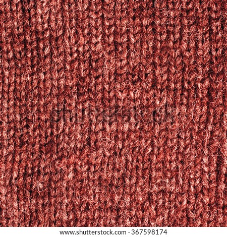 Red Knitted Wool Background.
