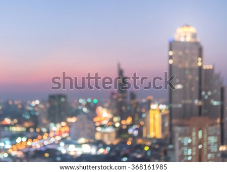 Blur city background rooftop view of cityscape business building landscape night lights bokeh