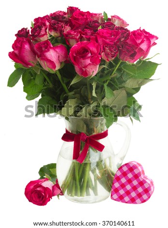 Bunch of dark pink  roses in glass vase with pink gift box  isolated on white background