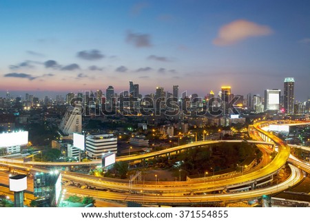 Panoramic building modern business district of Bangkok. S-shaped expressway in the foreground at twilight.