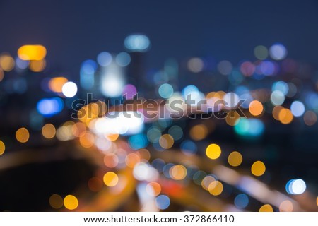 Abstract blurred bokeh light city business background and interchanged road night view