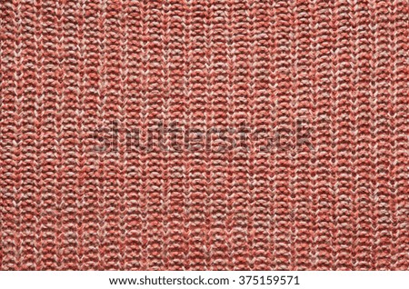 Red orange knitted sweater texture background. Space for copy, text, lettering.