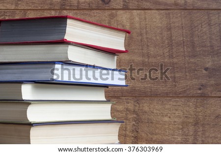 Old book on wooden background.