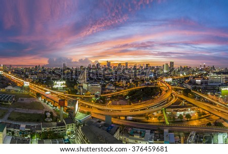 Traffic jam on express ways at the commercial zone of Bangkok in the evening red blue sunset 