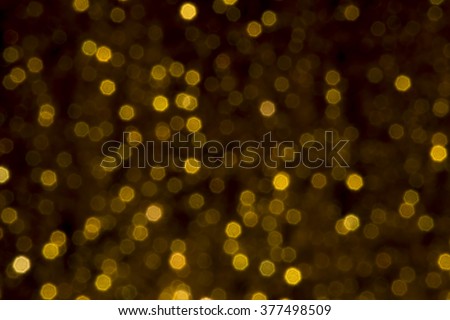 gold bokeh lights defocused. abstract background