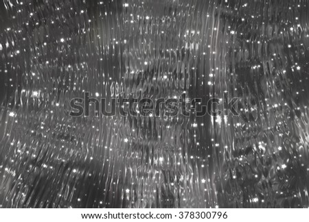 Bright abstract grey background with glitter