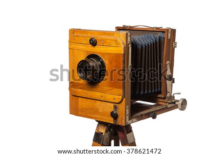 vintage foto camera with bellows on objective isolated on white background