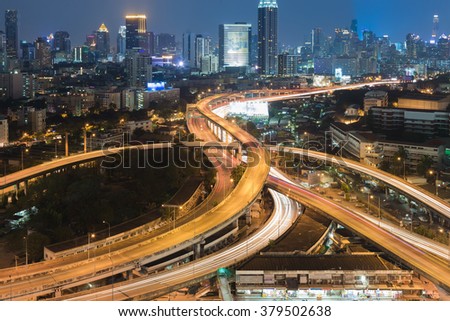 Highway interchanged with city downtown night view